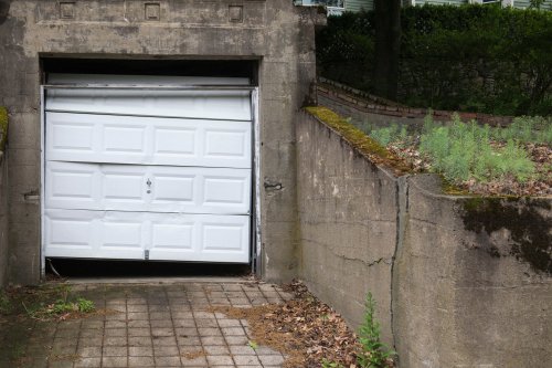 Broken white garage door