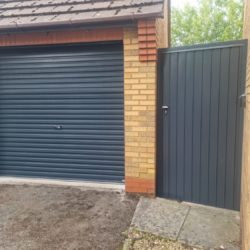 Black garage door and side door